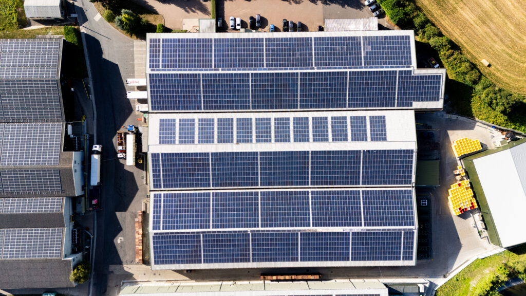 A photo of solar panels across a commercial building to help answer how to solar panels work